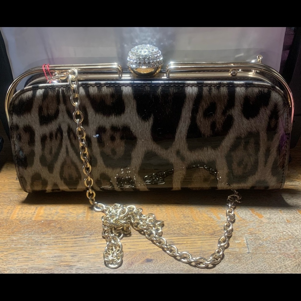 Leopard print patent leather clutch purse.